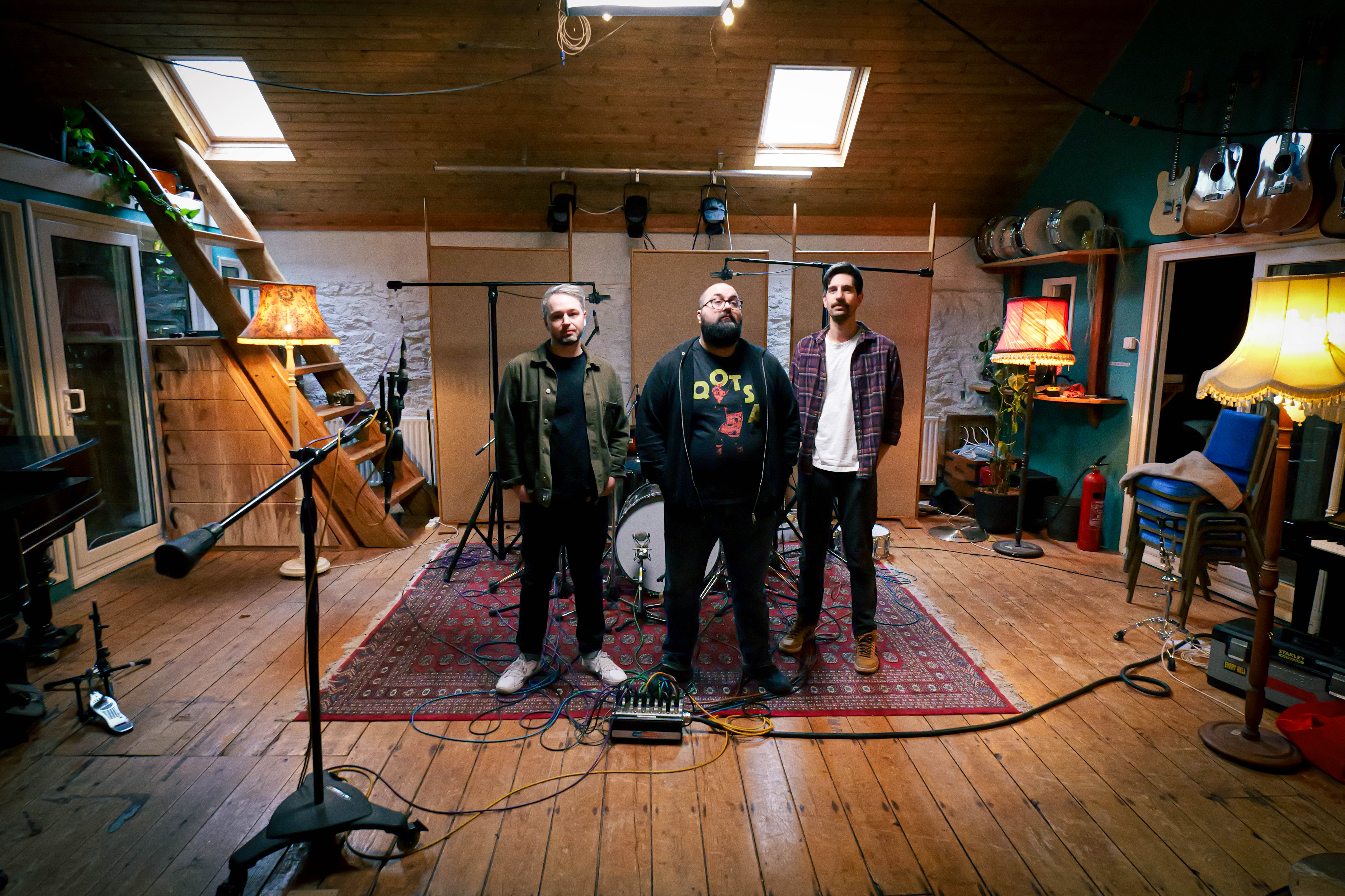 Rootwork standing in a recording studio